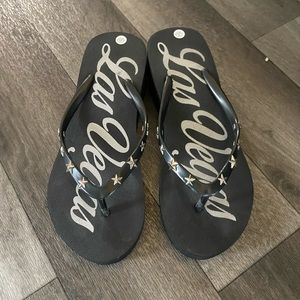 Black wedge flip flops size 5/6